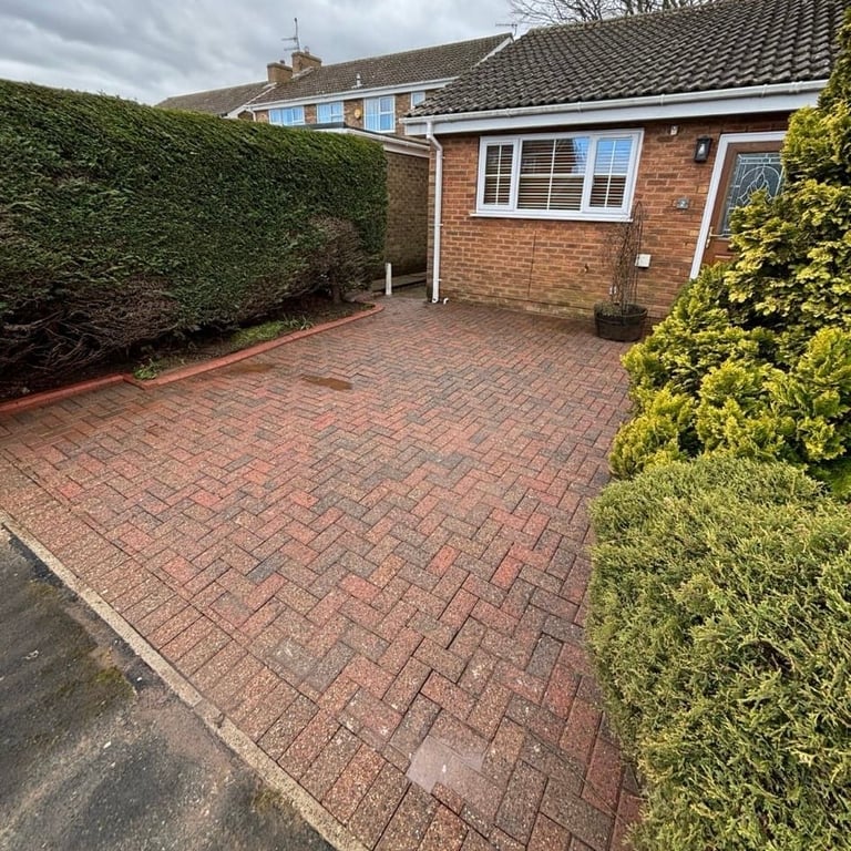 Brick patio with modern single-story house extension