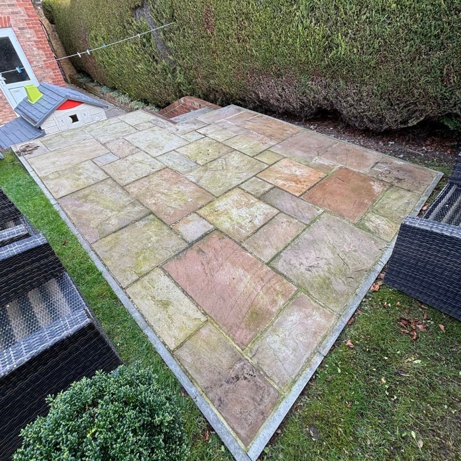 Weathered patio before cleaning